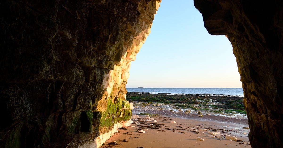 'Fairytale' beach just 2 hours from London with hidden caves unveiled at low tide