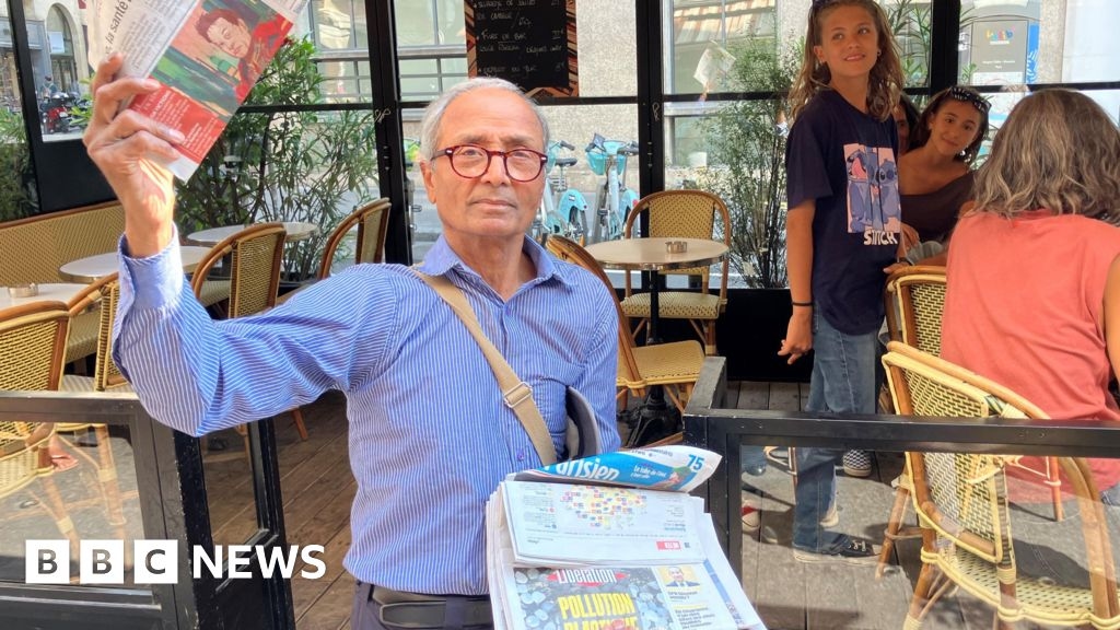 France's last newspaper hawker gets Order of Merit from his old customer - President Macron