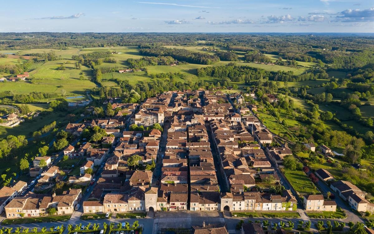 The village of Monpazier can be seen by torchlight