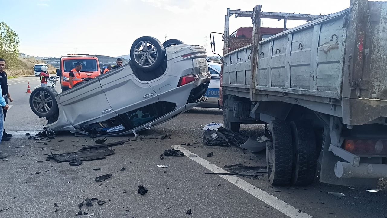 Vehicle crashes into truck and overturns: 2 injured
